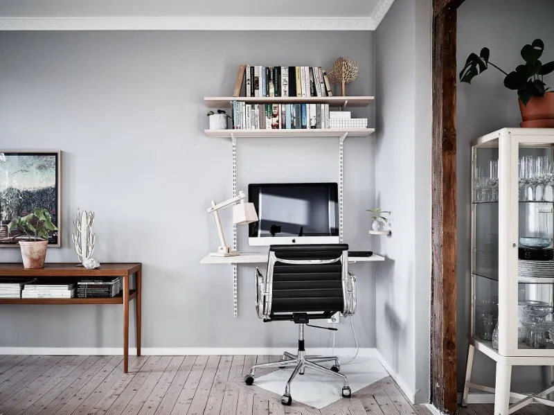 Compact Scandinavian workspace furniture with desk shelves and office chair