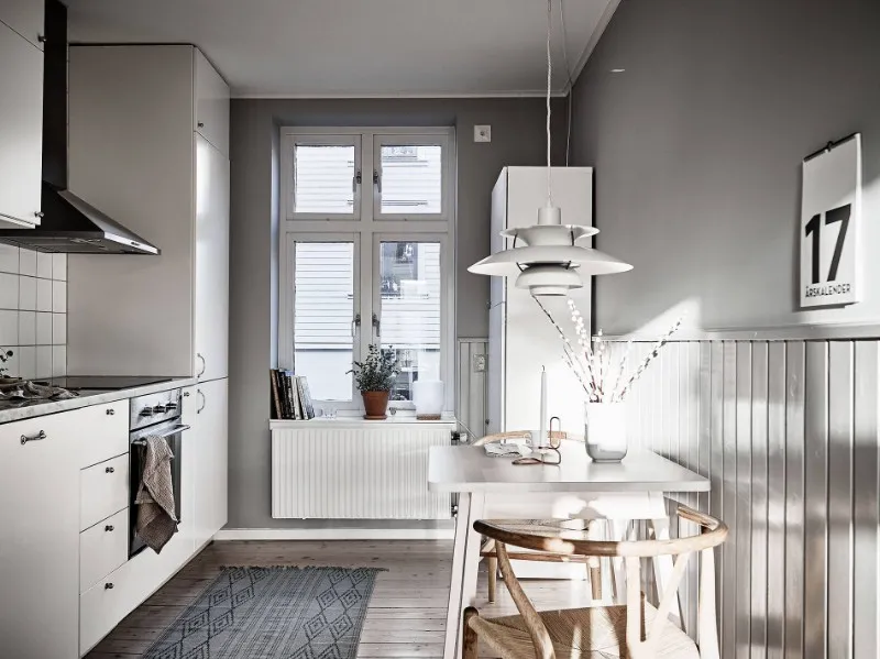 Compact apartment hotel kitchen and breakfast dining furniture in warm neutral finishes